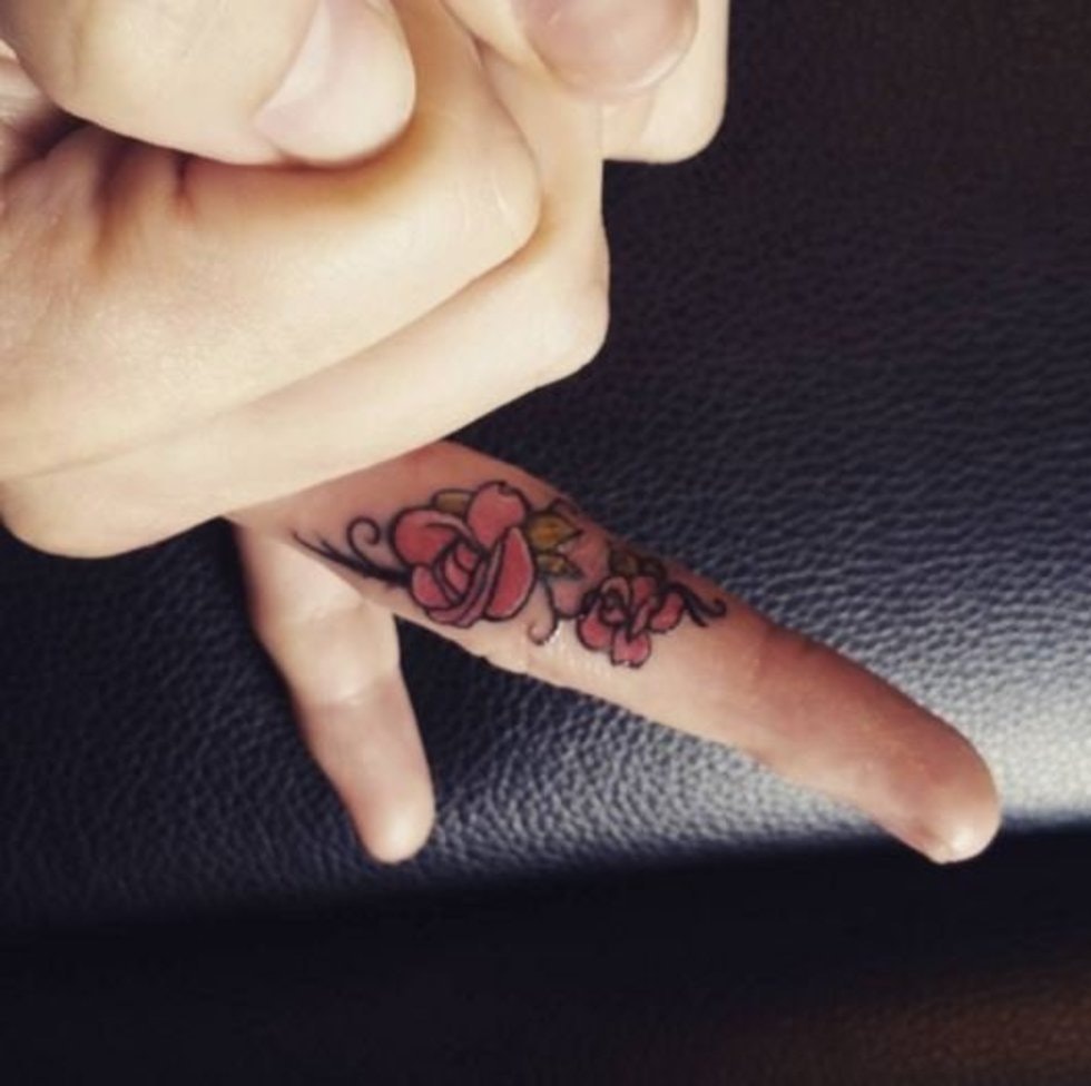 flower tattoo on finger
