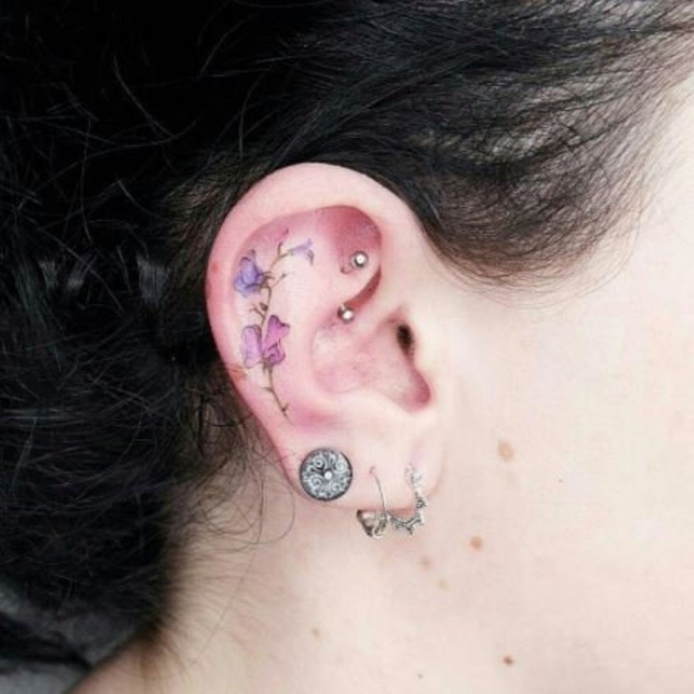 flower tattoo in ear