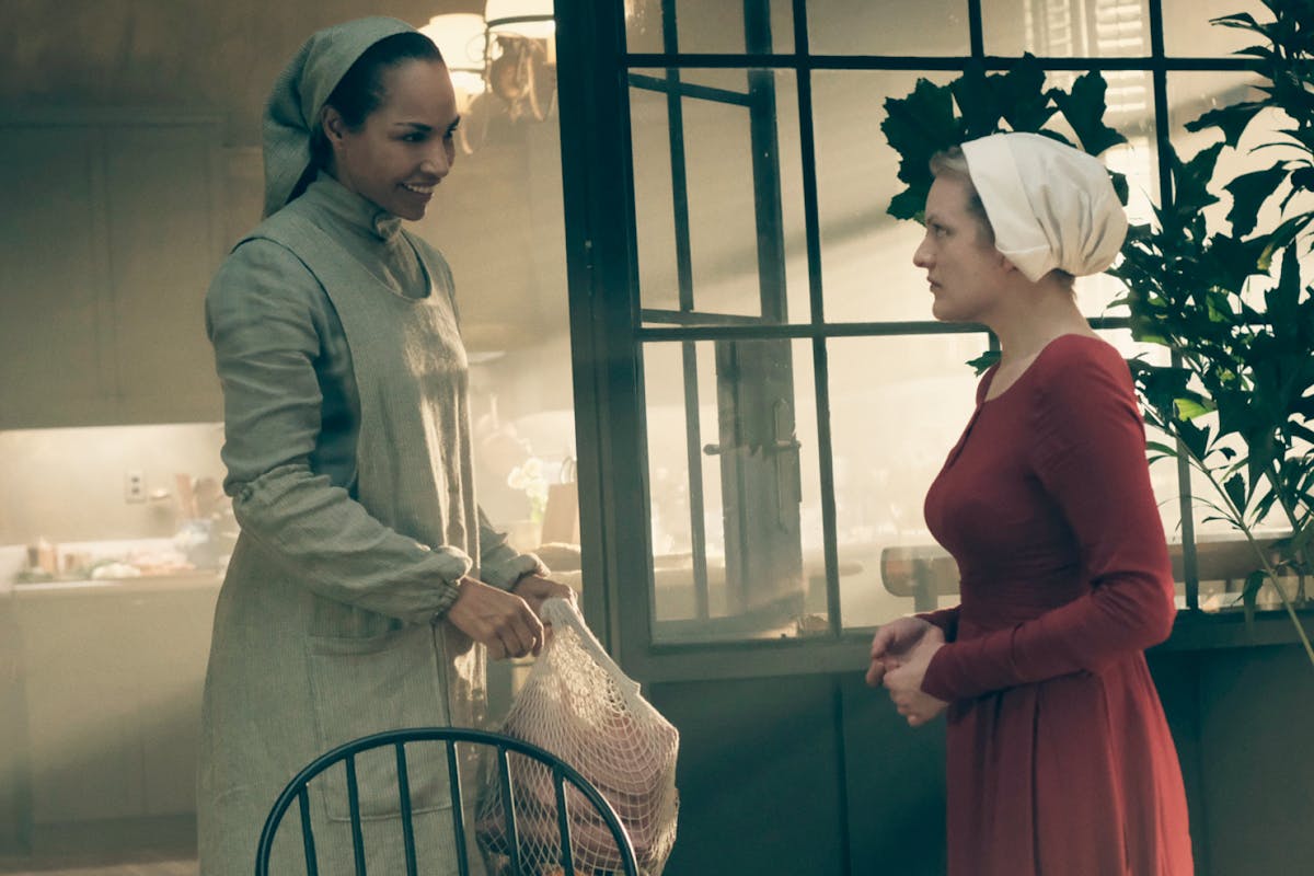 Rita (Amanda Brugel) and Offred/June (Elisabeth Moss) in The Handmaid's Tale