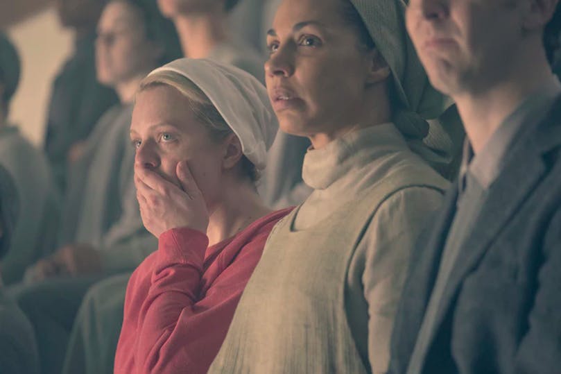 June (Elisabeth Moss) reacts to execution in Postpartum, The Handmaid's Tale