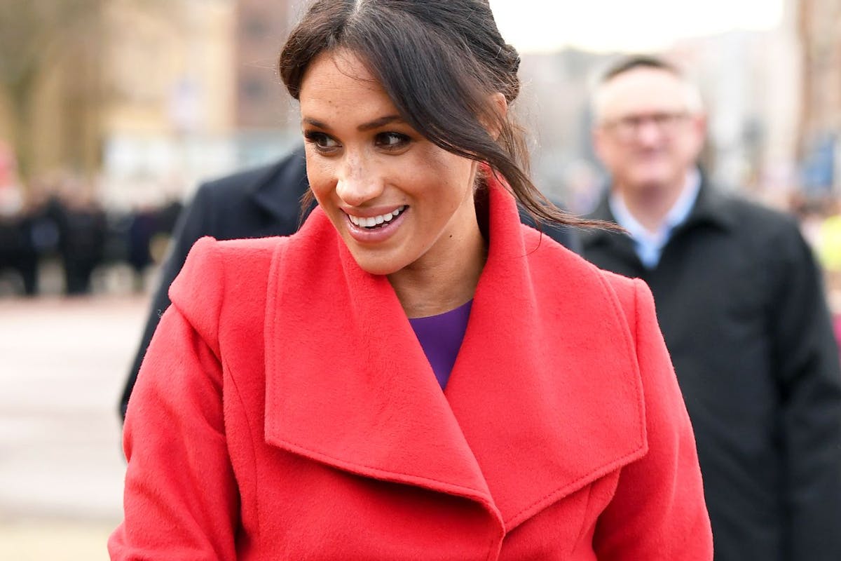 Meghan Markle in a red coat