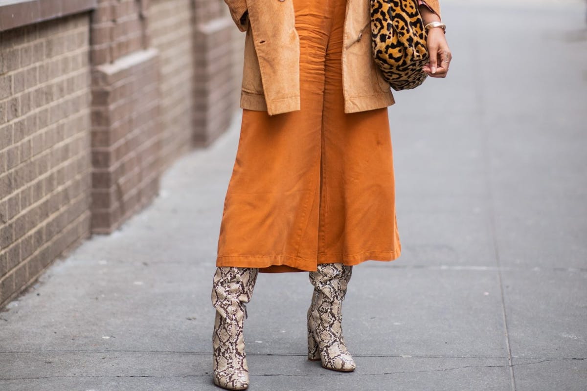 Street style stars at fashion month have made snake the key animal print.
