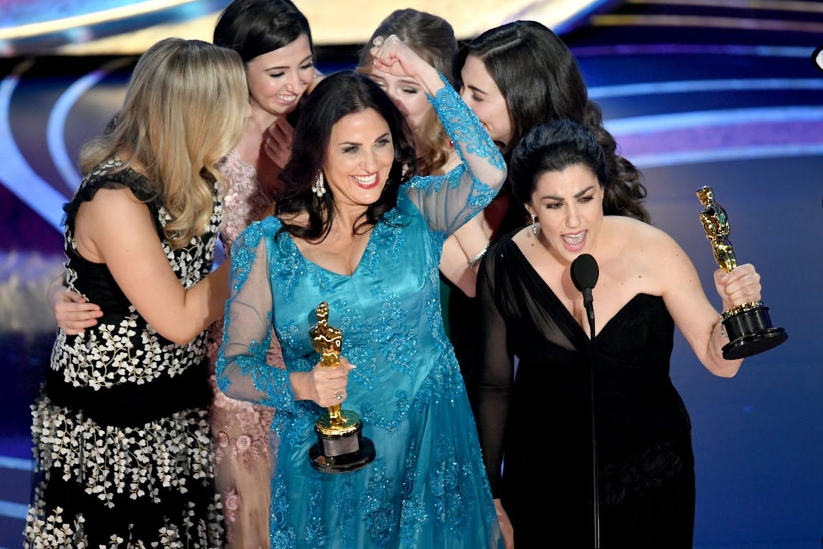 HOLLYWOOD, CALIFORNIA - FEBRUARY 24: Melissa Berton (center L) and Rayka Zehtabchi (center R) accept the Short Film (Live Action) award for 'Period. End of Sentence.' onstage during the 91st Annual Academy Awards at Dolby Theatre on February 24, 2019 in Hollywood, California. (Photo by Kevin Winter/Getty Images)