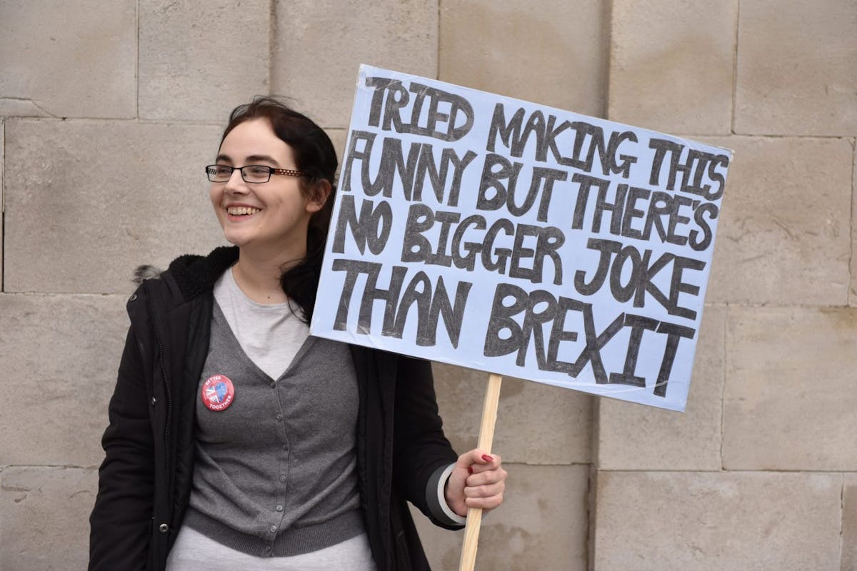 A woman holds an anti-Brexit sign at the Put It To The People march in London