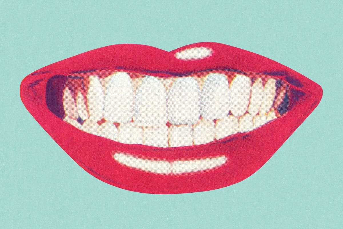 smiling-mouth-teeth-on-blue-background