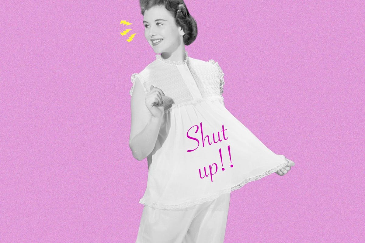 Woman poses wearing T shirt reading 'Shut Up'