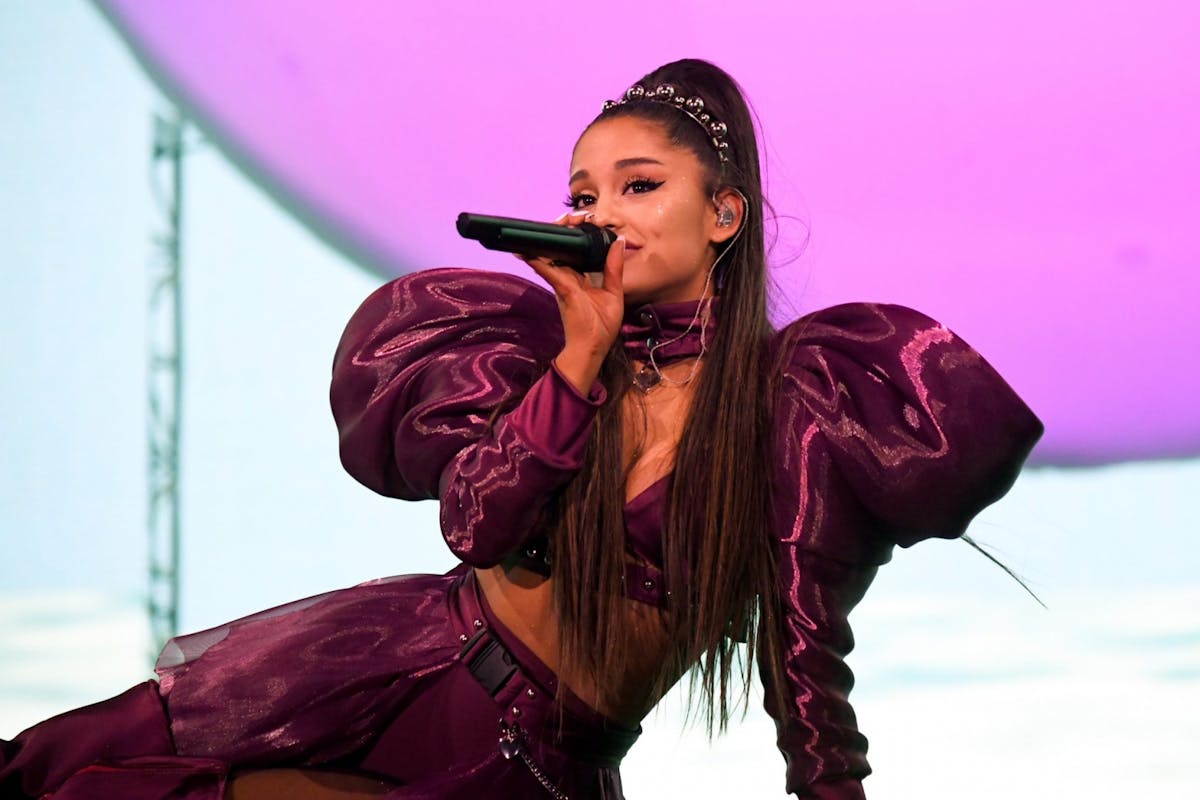 Ariana Grande singing on-stage at her Sweetener tour