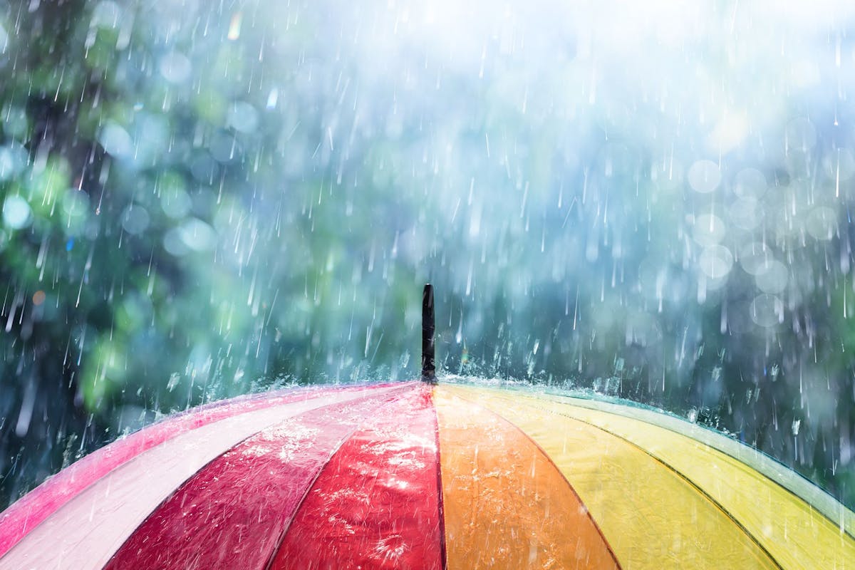 Multi Colored Umbrella With Raindrop Shower