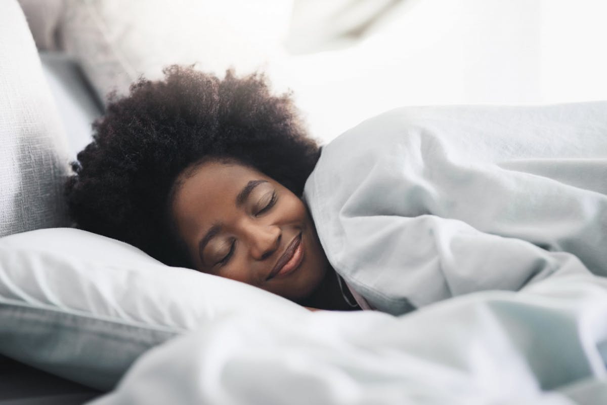 A woman having a good night's sleep