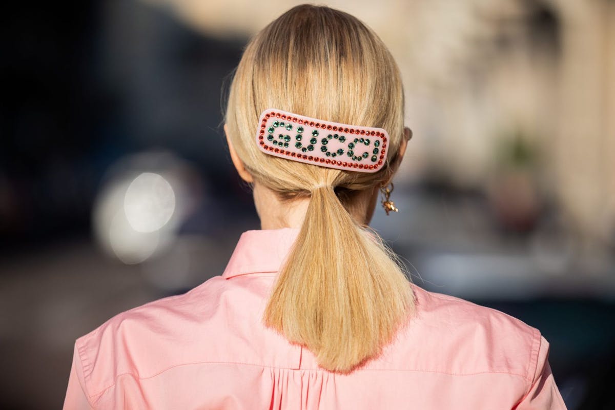 Milan Fashion Week: a show goer wears the pastel trend with Gucci accessories