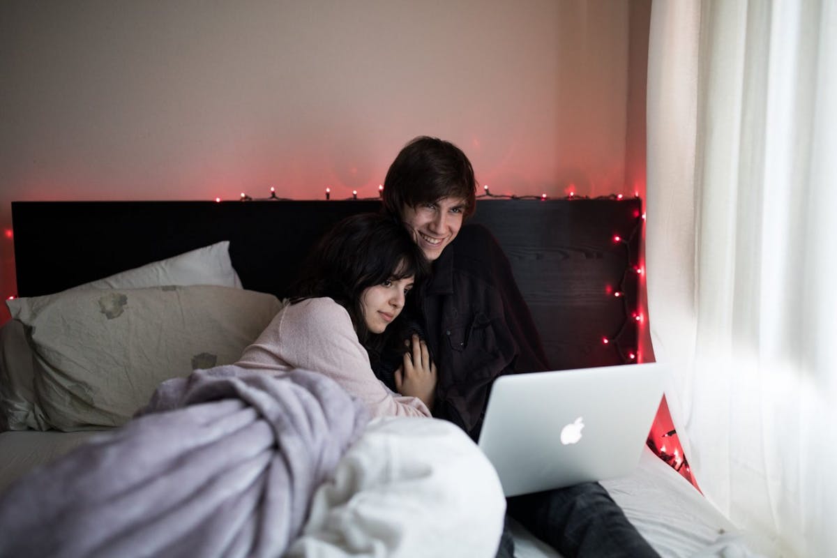 Couple watching Netflix on laptop
