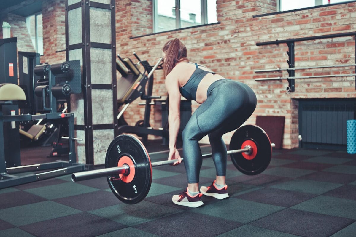 Woman deadlifting in a gym