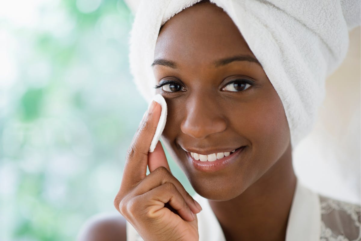 woman-using-cotton-pad-on-face-skincare