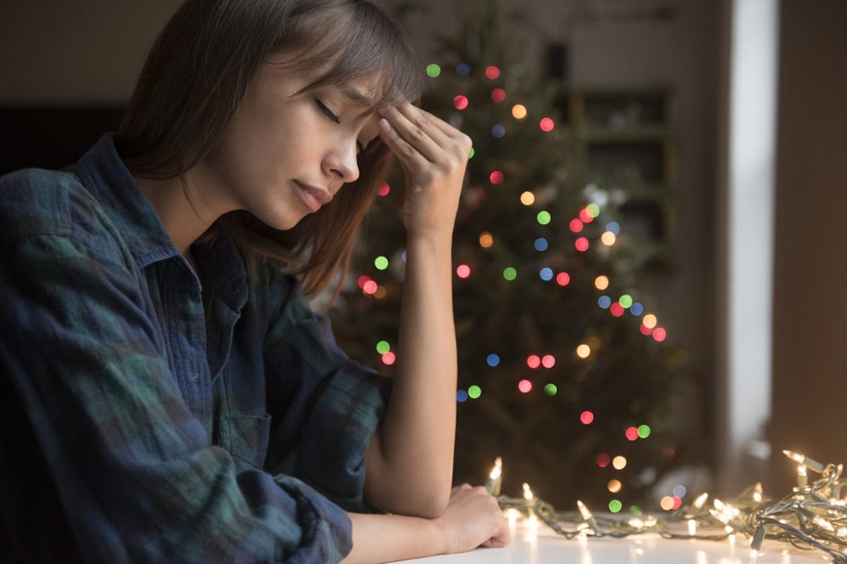 A woman feeling stressed at Christmas