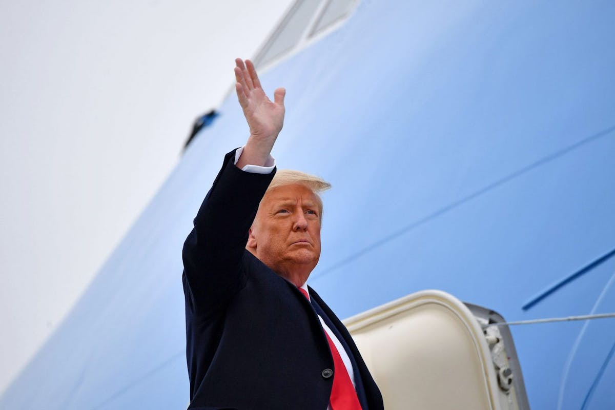 US President Donald Trump boards Air Force One
