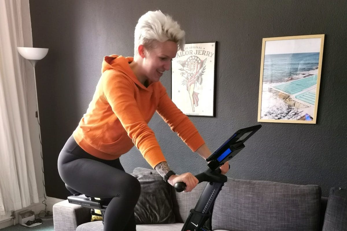woman cycling indoors