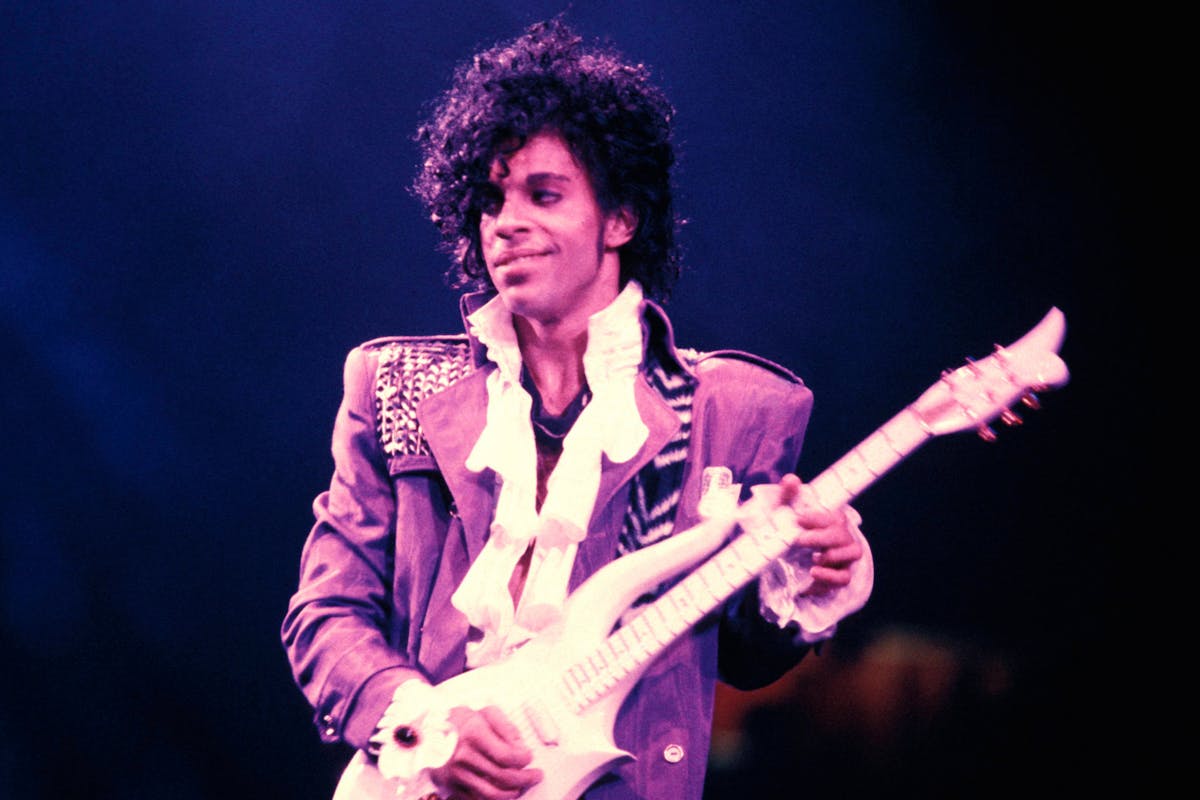 Prince playing the guitar