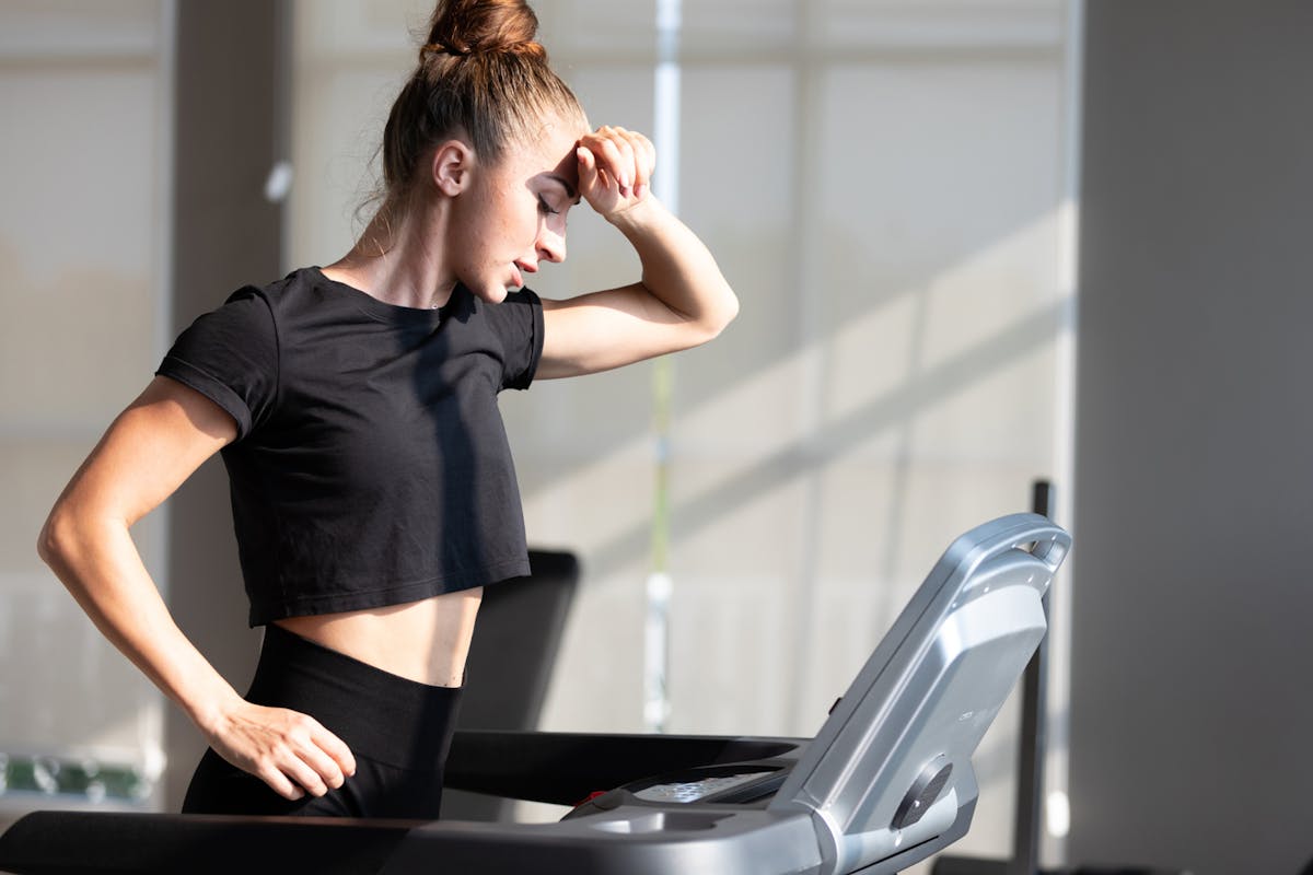 A tired woman on a treadmill