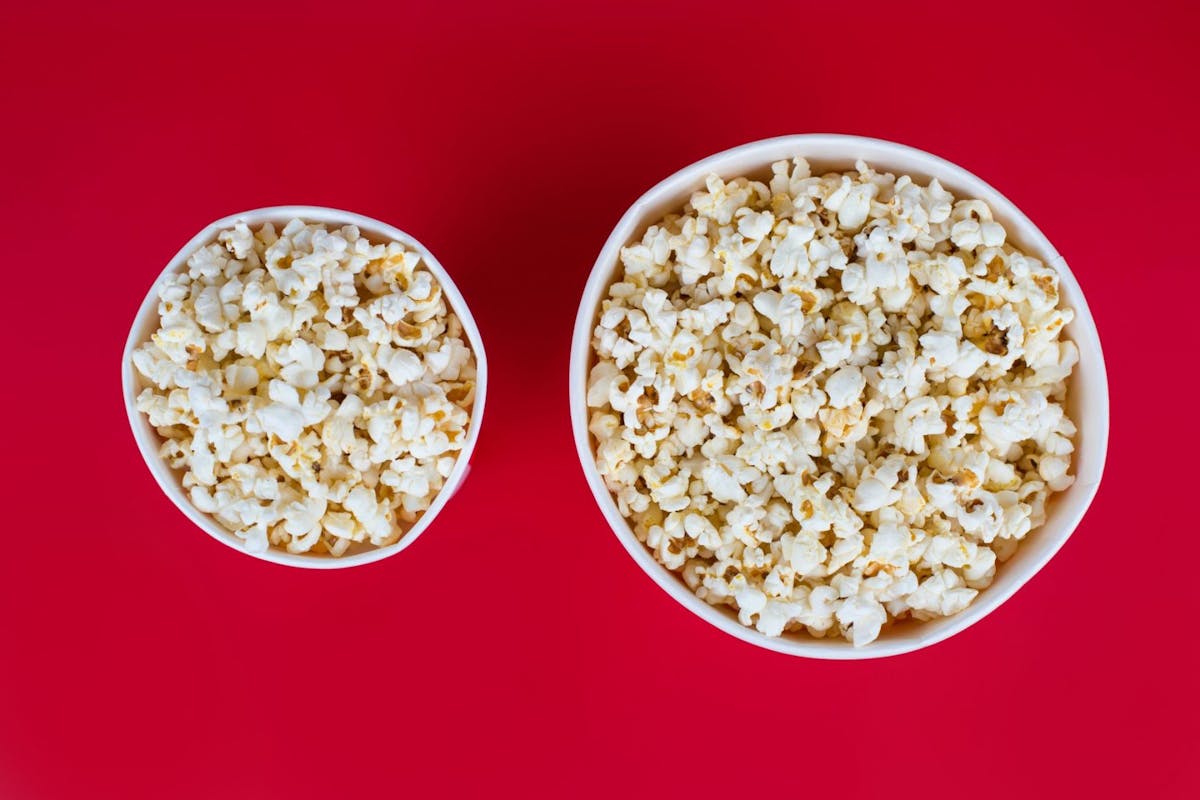 Two bowls of popcorn shot from above