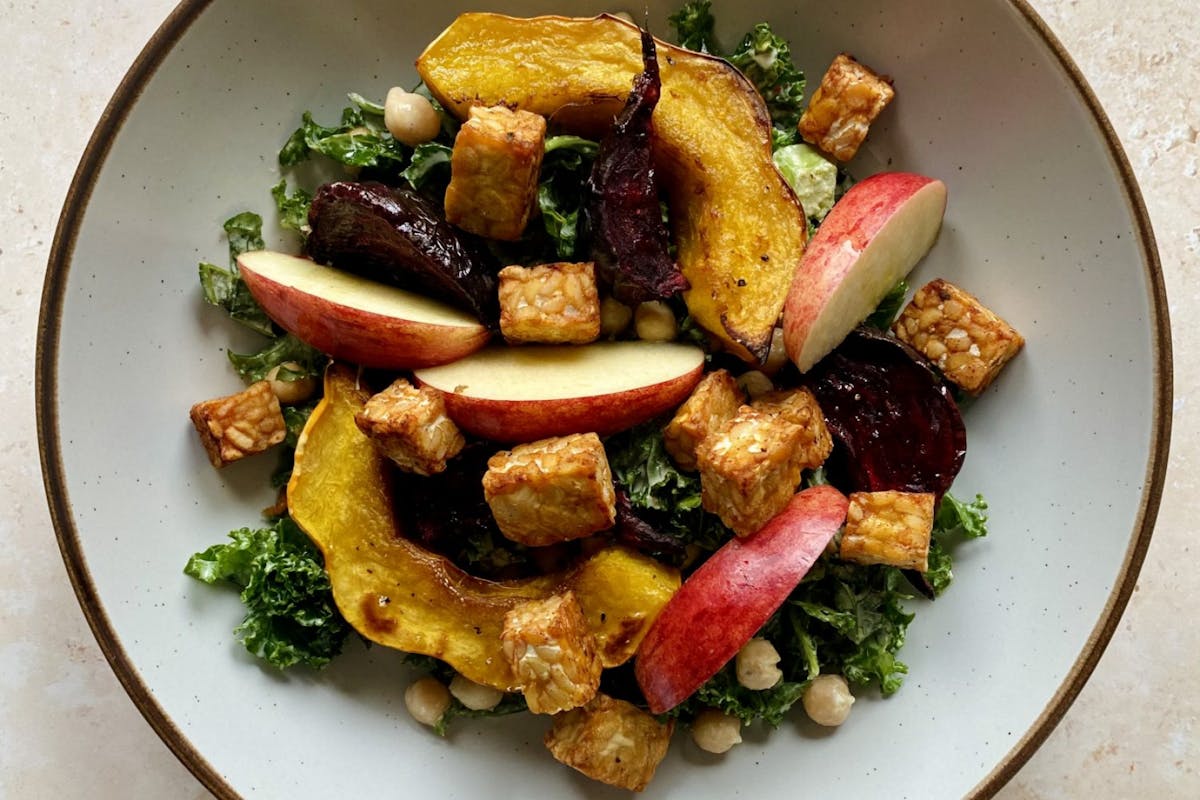 Warm autumnal salad with apple, squash, beetroot, chickpeas and kale