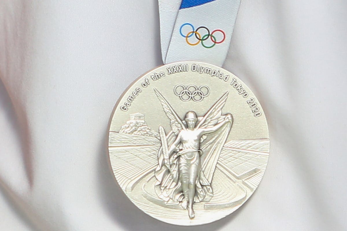 A close up of a Tokyo medal