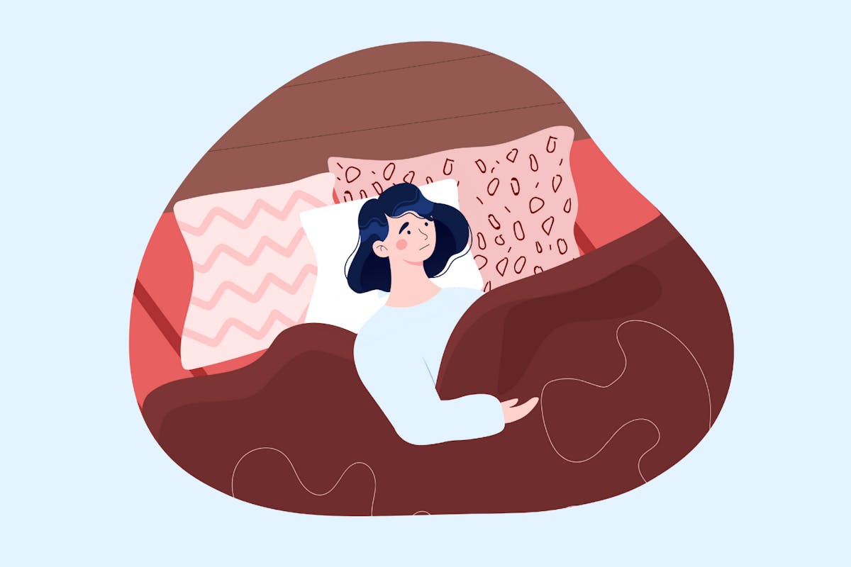 A woman lying in bed with anxiety