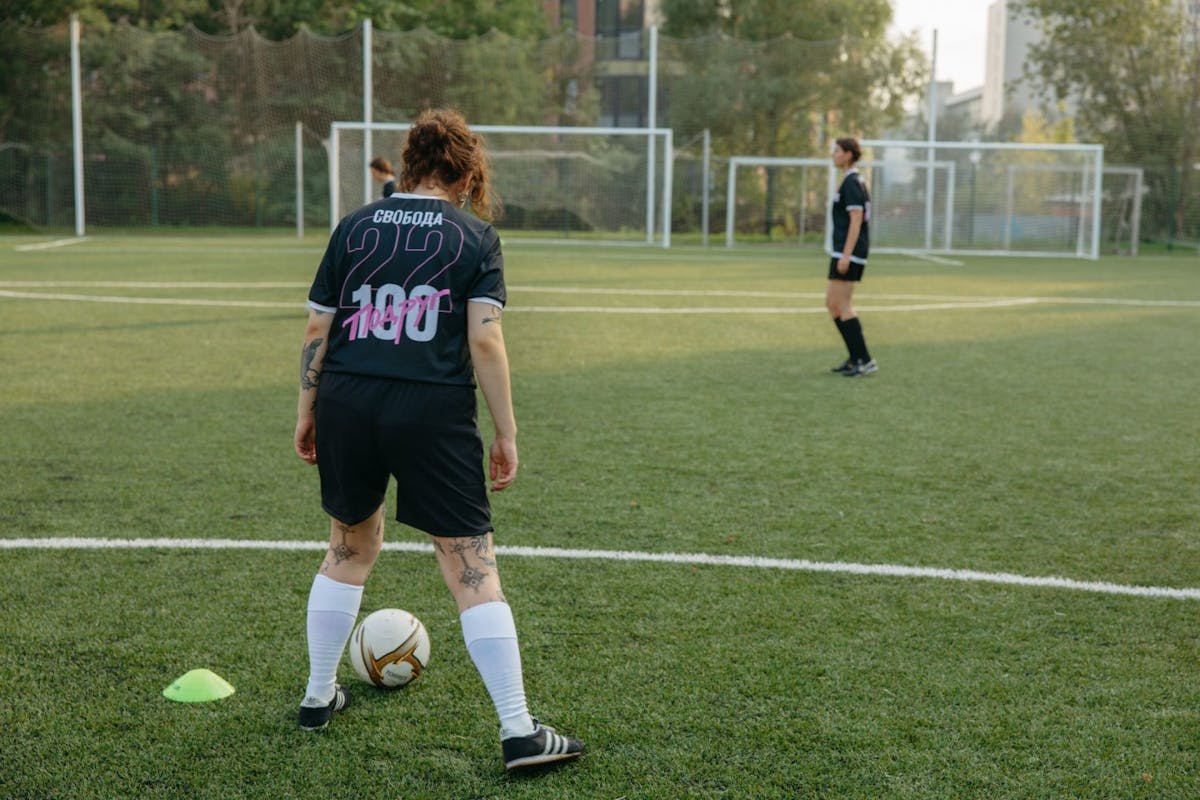 Anonymous women on football pitch