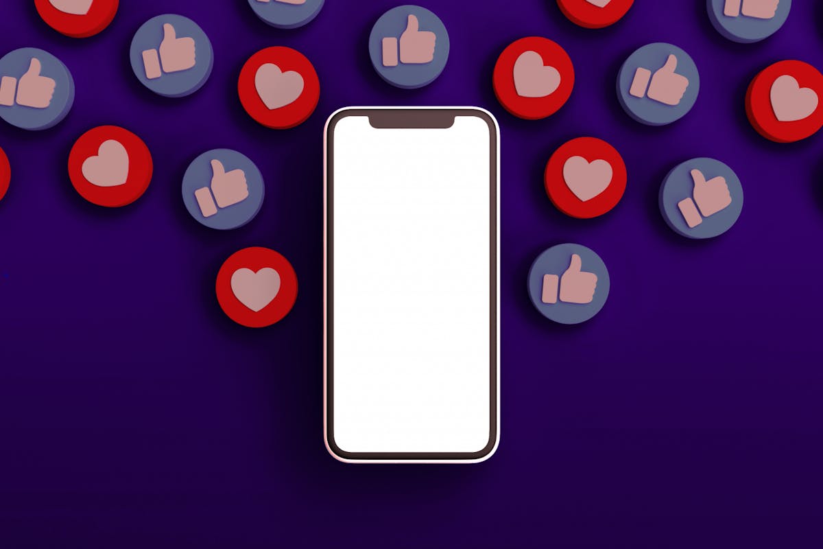 heart icons surround phone screen of someone who is nervous about sharing photos on instagram