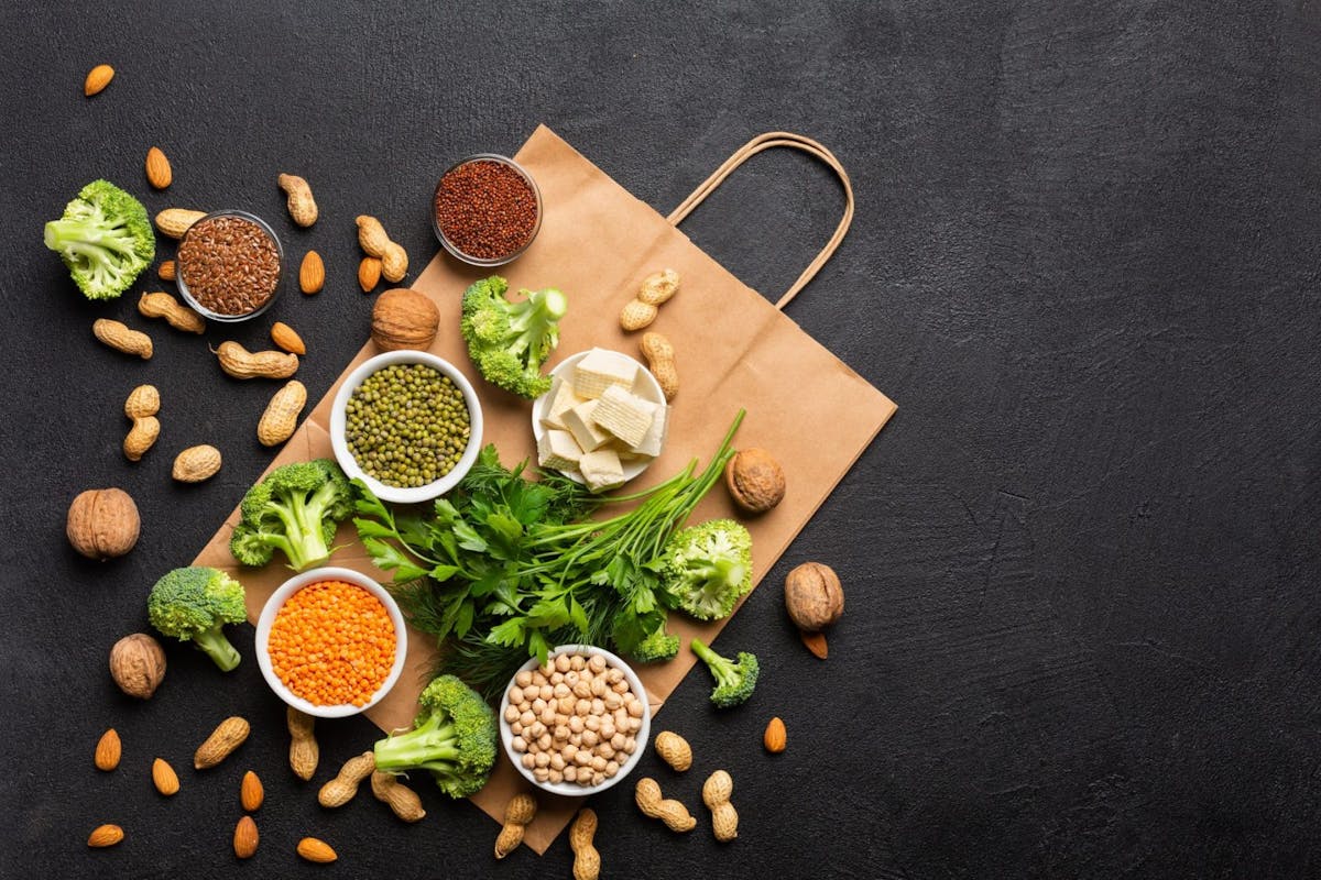 Flatlay of different proteins, including chickpeas, cheese and veg
