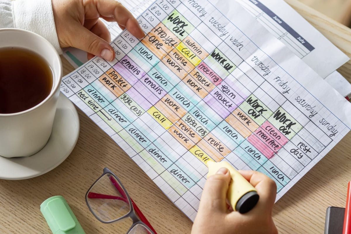 woman with weekly planner