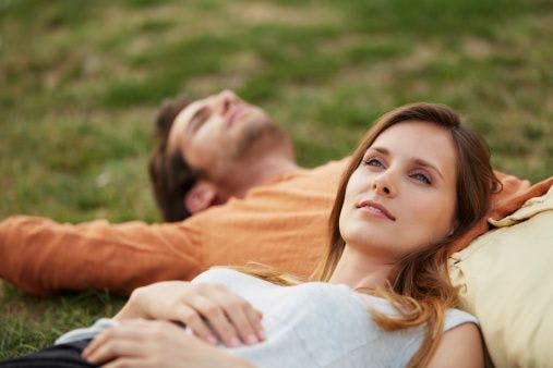Couple meditating practicing self-care for relationship