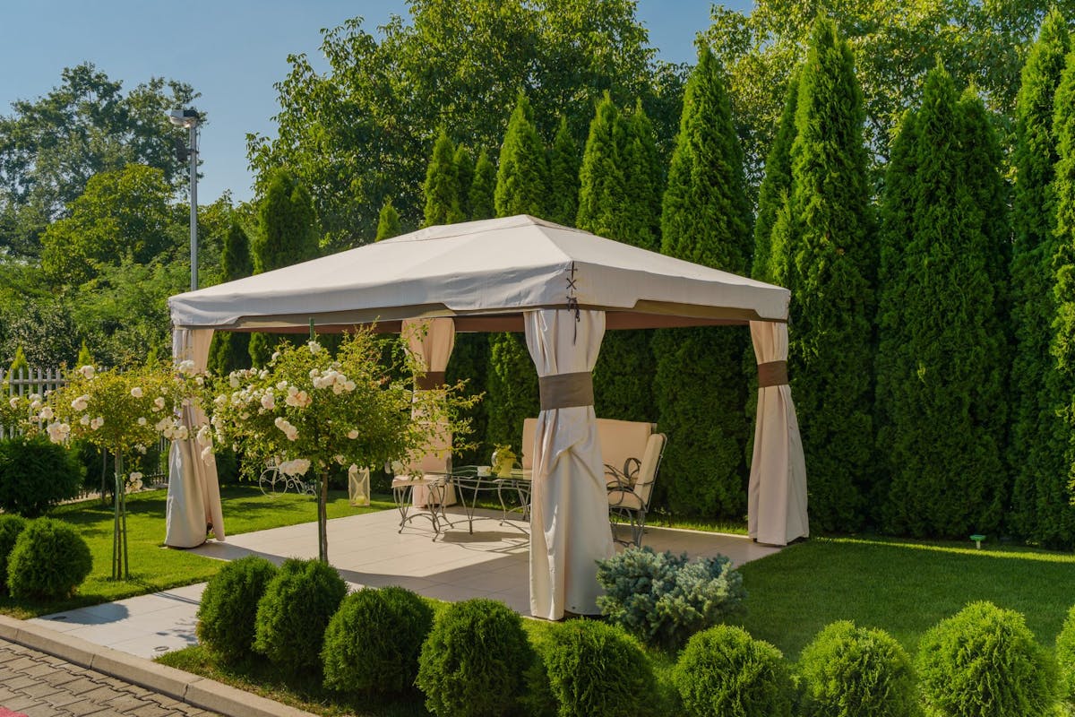 Chairs and Tables under Gazebo with White Tent