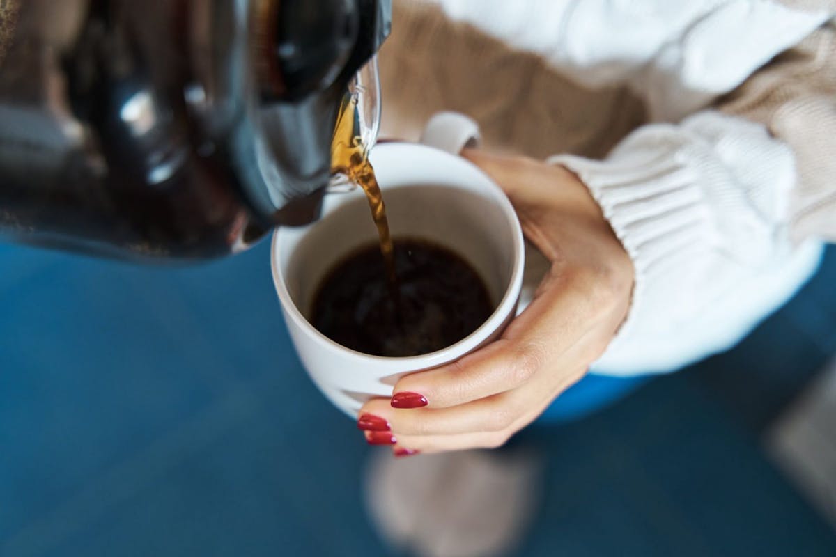 Woman pouring coffee