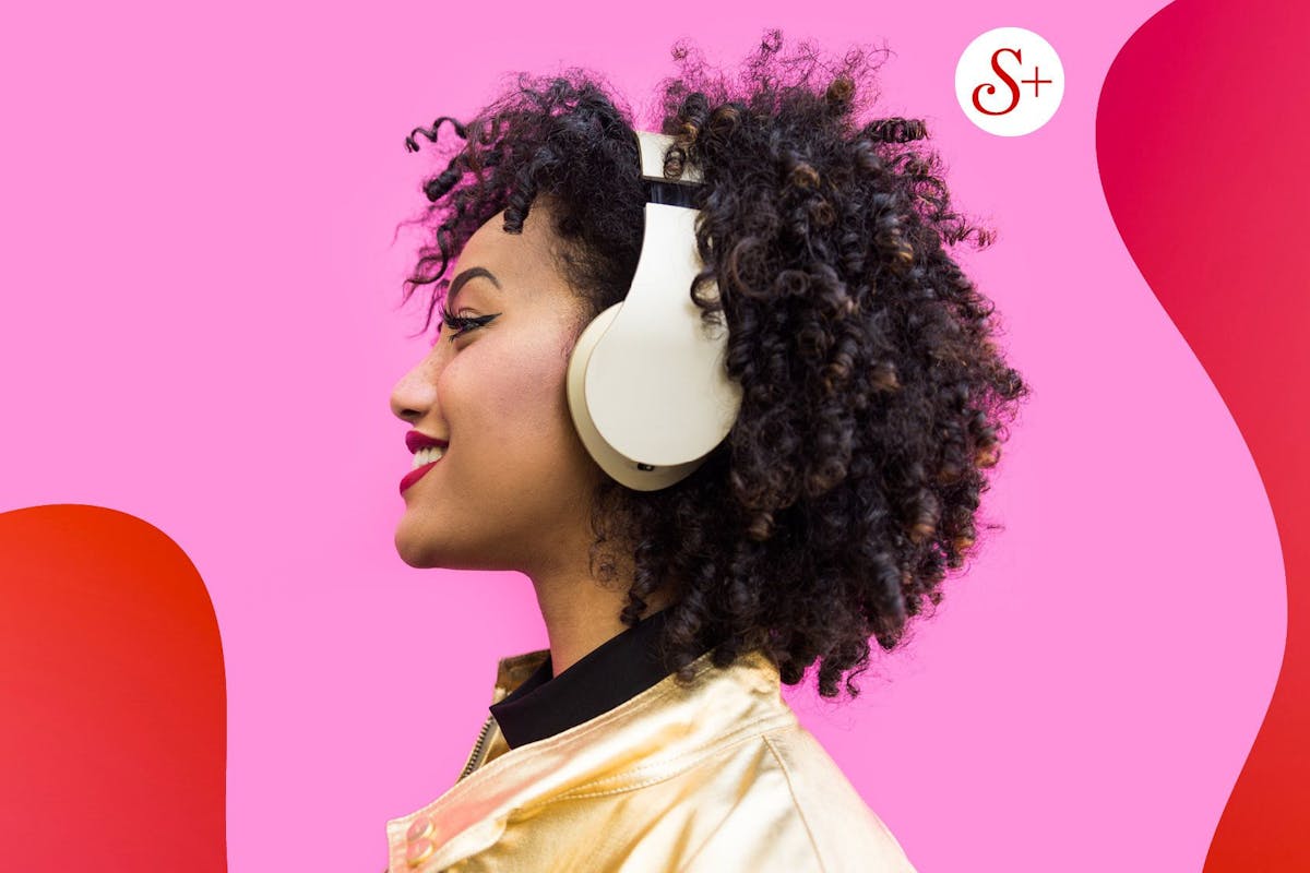young woman profile wearing headphones