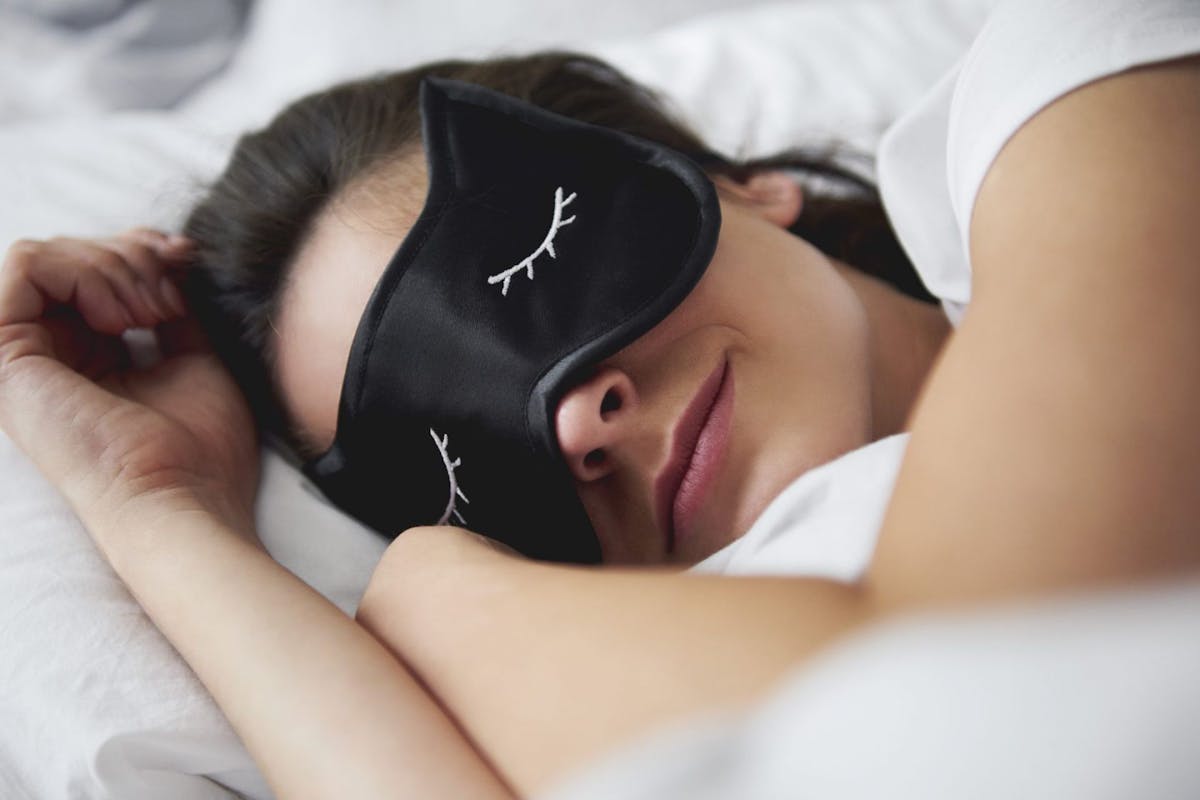 Woman sleeping in an eye mask