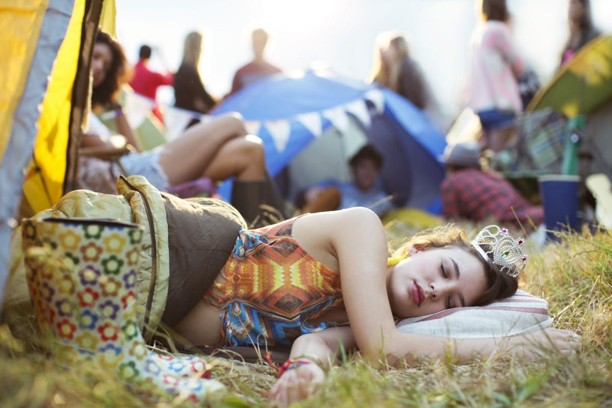 woman sleeping at festival