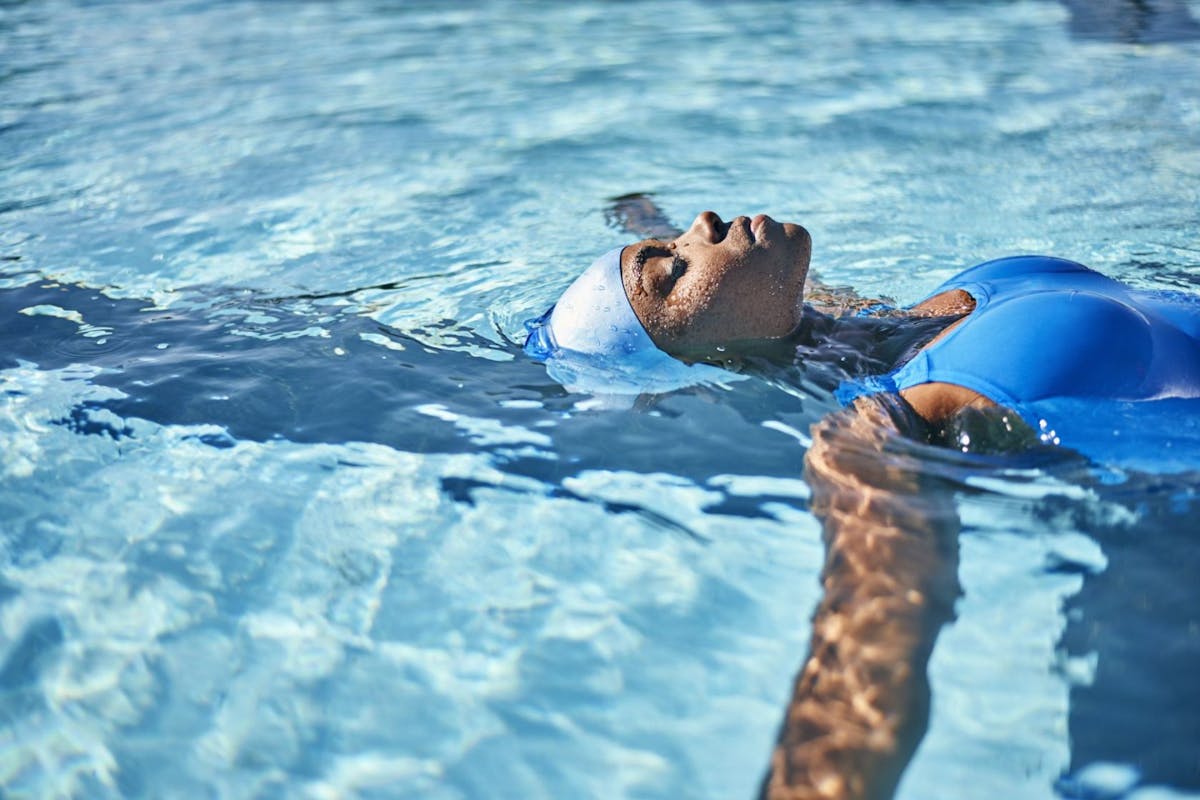 Woman swimming back stroke