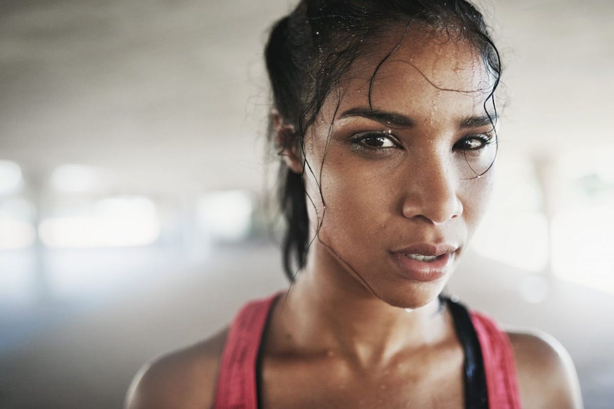 Sweaty woman in gym kit